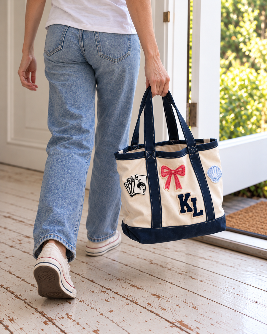 Woman carrying the Natural and Navy patch tote