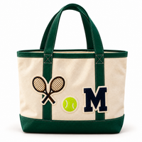 The Everyday Tote in Natural & Green with crossed tennis rackets, tennis ball and navy M monogram patches