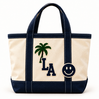 The Everyday Tote in Natural & Navy with palm tree, LA letter and smiley face patches